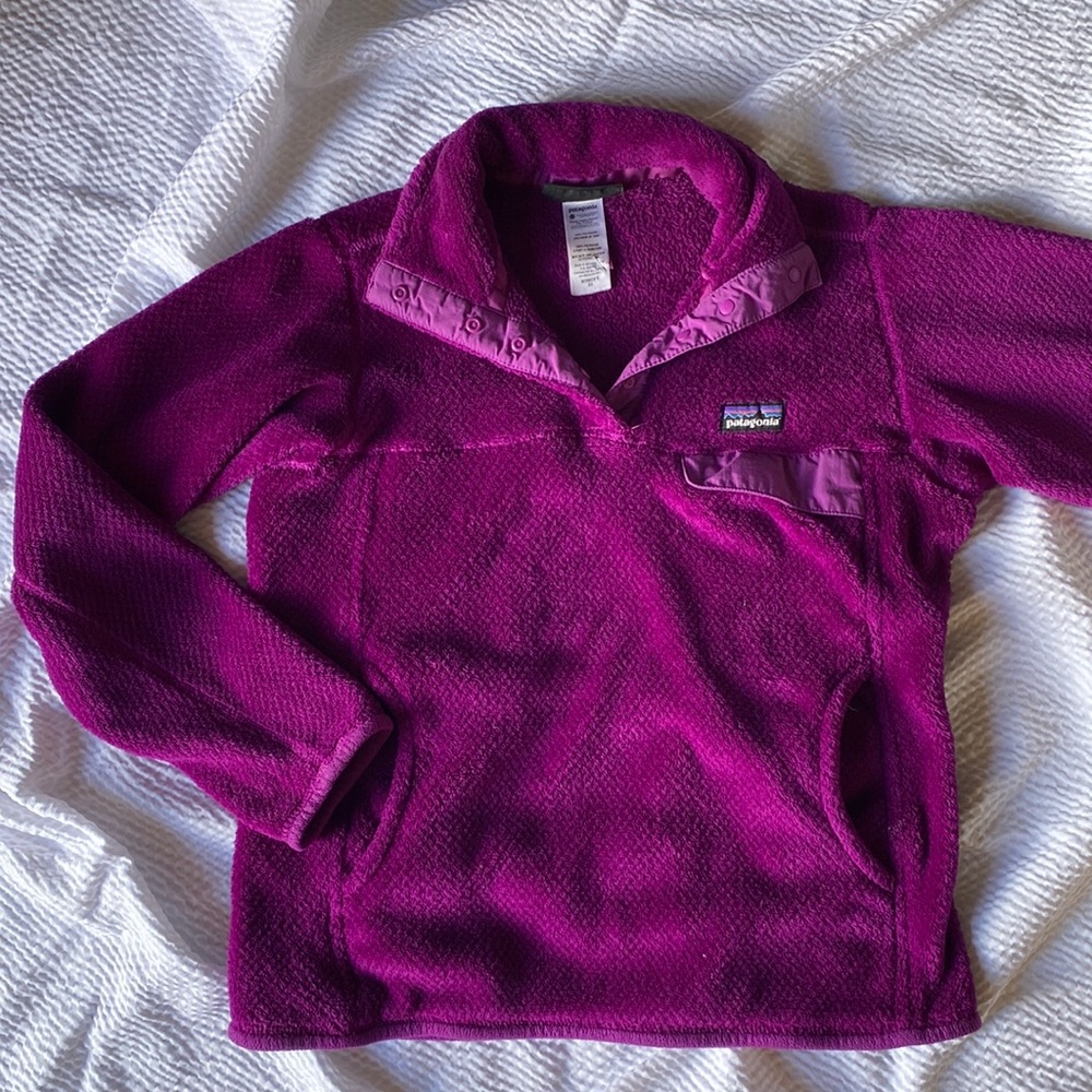 Purple pullover with hole in sleeve